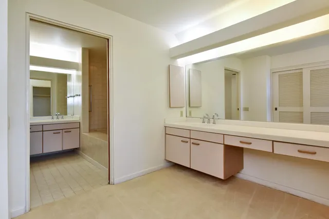 a bathroom with a sink a mirror and a bathtub