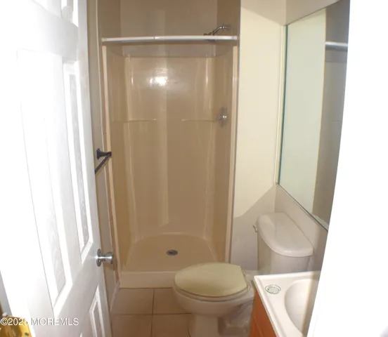 a kitchen with a refrigerator and a sink