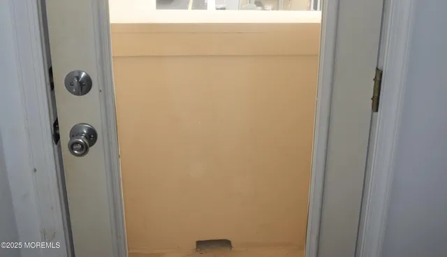 a bathroom with a granite countertop bathtub shower and toilet