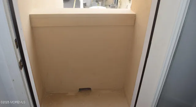 a bathroom with a granite countertop toilet and a shower