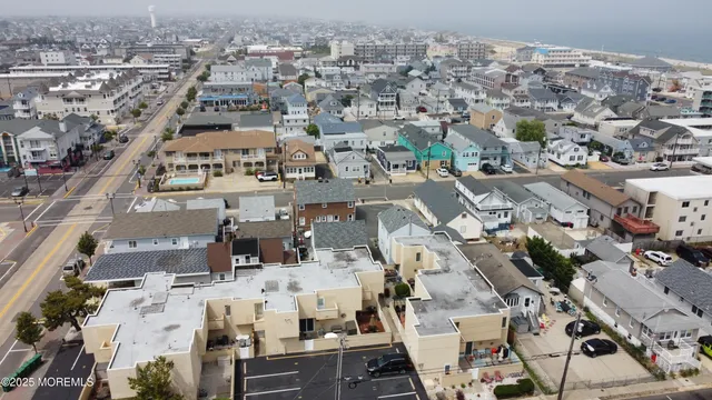 a view of roof deck with seating space and trees