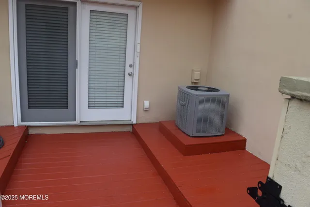 a view of room with wooden floor