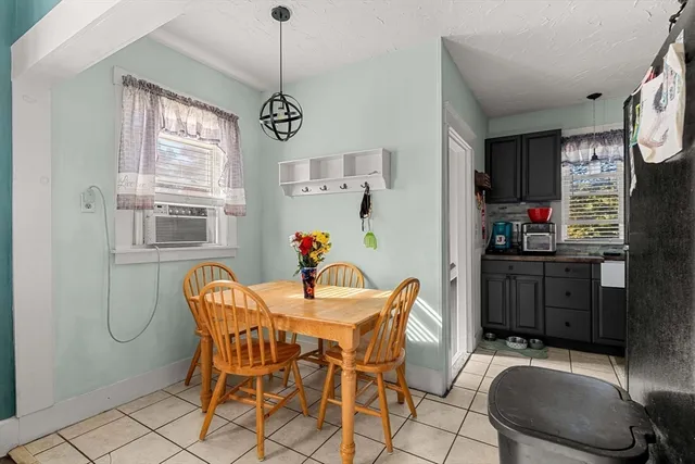 a view of a dining room with furniture window and outside view