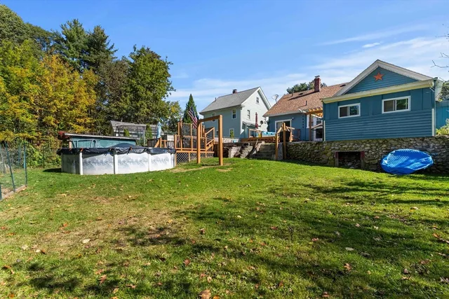 a view of a house with a yard porch and sitting area