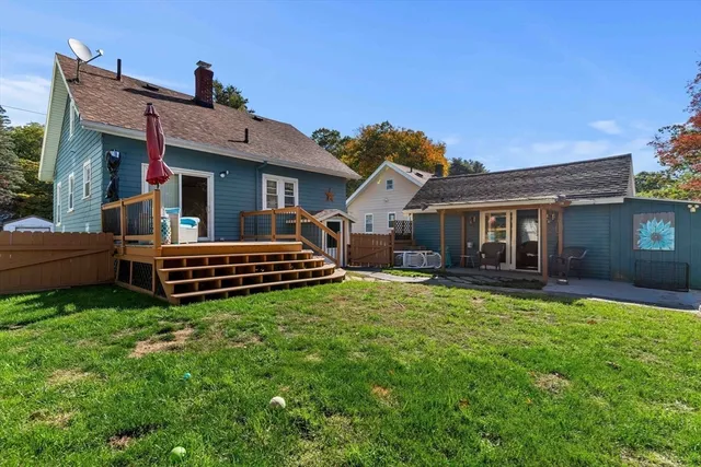 a front view of house with yard outdoor seating and yard