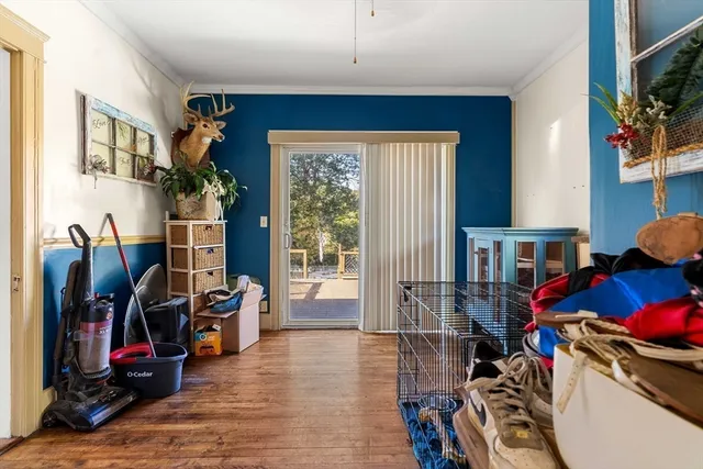 a view of a livingroom with workspace and a window
