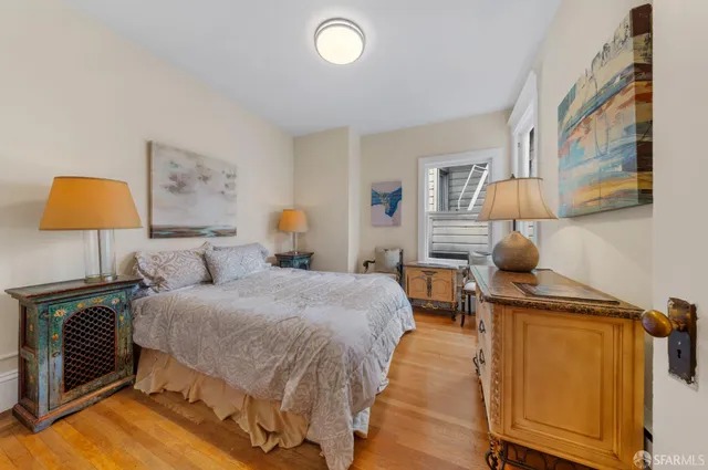 a kitchen with a refrigerator a sink and cabinets