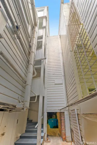 a view of an entryway with wooden floor and stairs