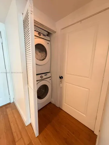 a view of a hallway with washer and dryer