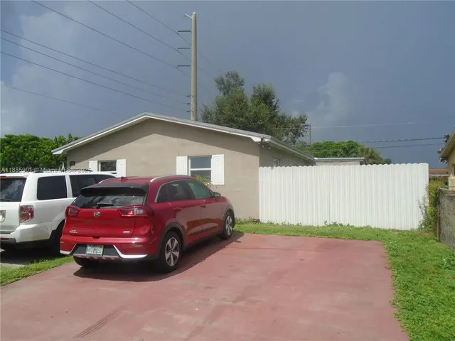 a view of a car in front of house