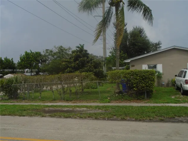 a backyard of a house and trees