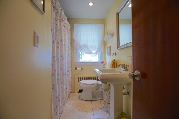 49 Faywood Avenue Boston, MA 02128 - Photo 16 of 30 a bathroom with a sink toilet and shower