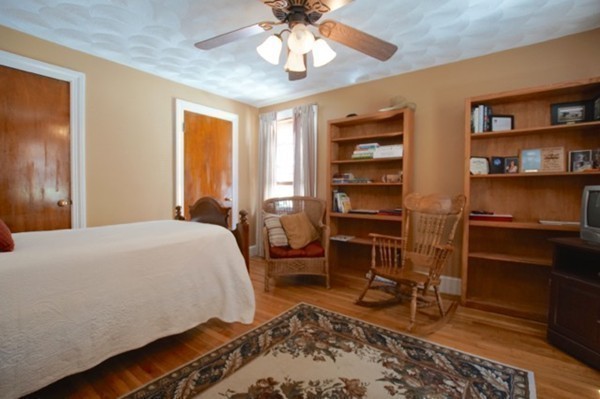 49 Faywood Avenue Boston, MA 02128 - Photo 17 of 30 a bedroom with a bed and a bookshelf