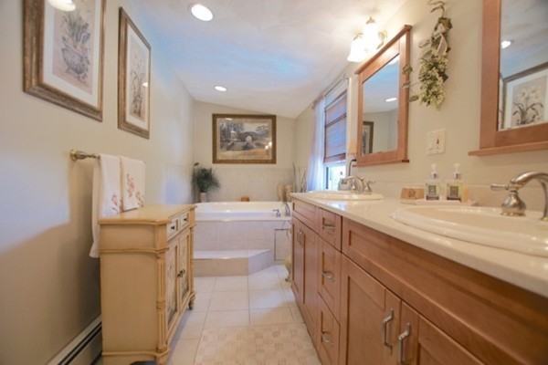 49 Faywood Avenue Boston, MA 02128 - Photo 21 of 30 a bathroom with a sink mirror vanity and toilet