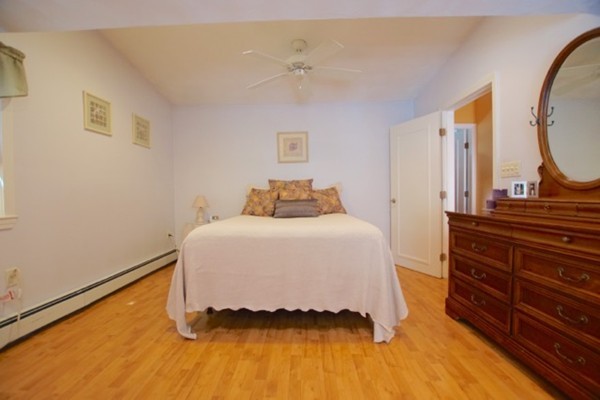 49 Faywood Avenue Boston, MA 02128 - Photo 23 of 30 a bedroom with a bed and a mirror