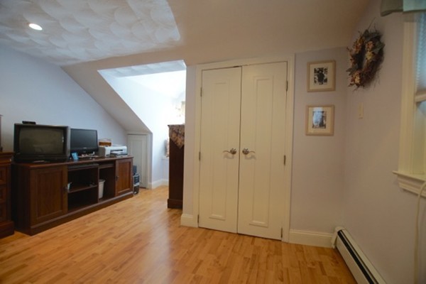 49 Faywood Avenue Boston, MA 02128 - Photo 24 of 30 a view of a livingroom with wooden floor and a flat screen tv