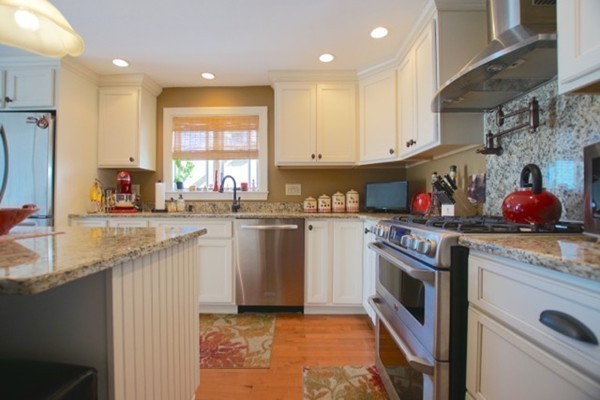49 Faywood Avenue Boston, MA 02128 - Photo 5 of 30 a kitchen with granite countertop a sink stainless steel appliances and cabinets