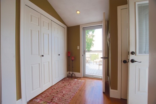 49 Faywood Avenue Boston, MA 02128 - Photo 7 of 30 a view of a hallway with wooden floor and closet area