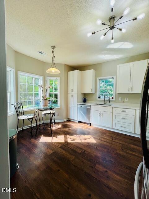 6016 River Lake Circle Raleigh, NC 27604 - Photo 7 of 15 a view of kitchen with dining area cabinets and wooden floor