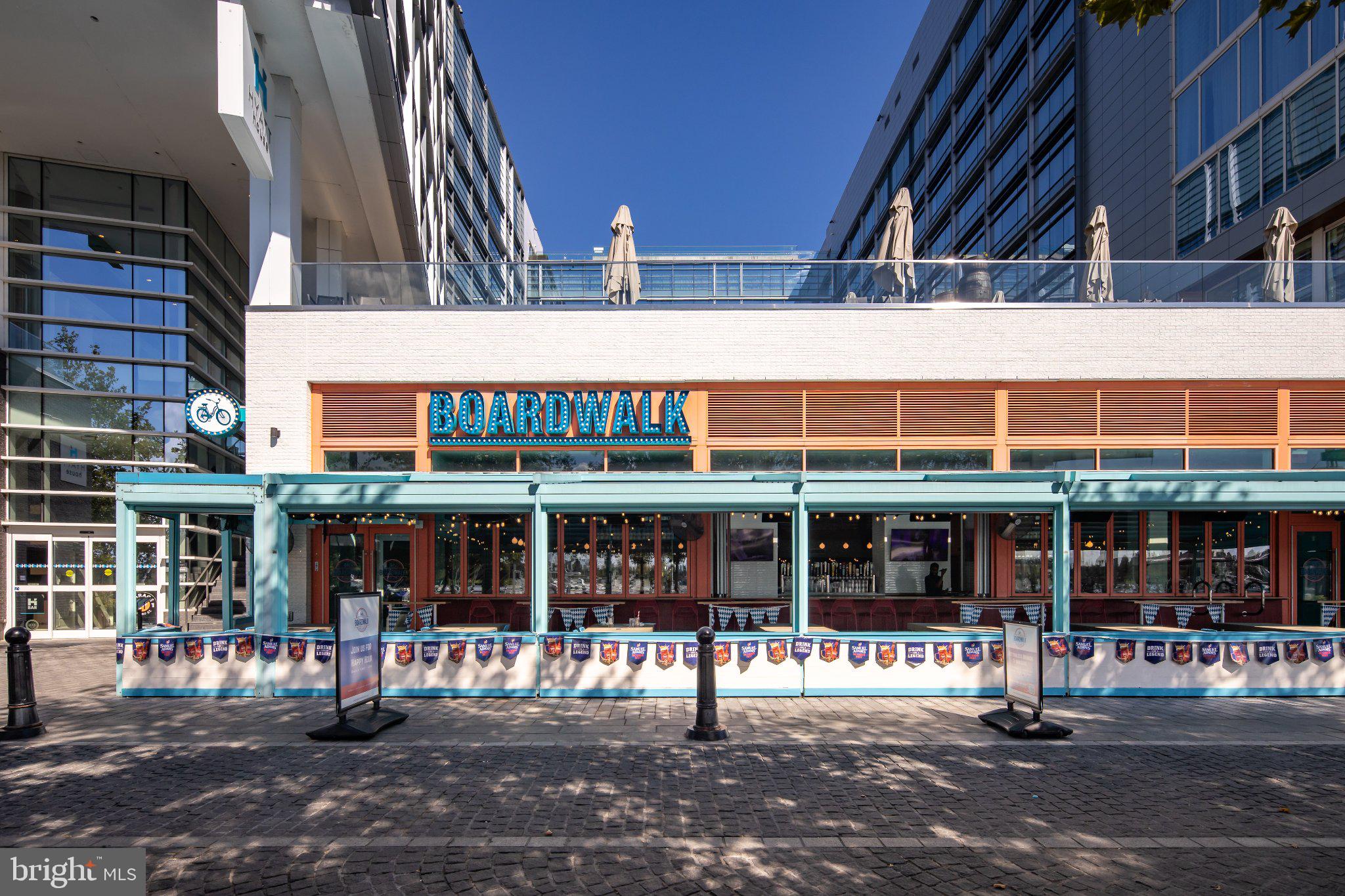 525 Southwest Water Street Southwest, Unit 404 Washington, DC 20024 - Photo 63 of 82 Vibrant dining at Boardwalk venue.
