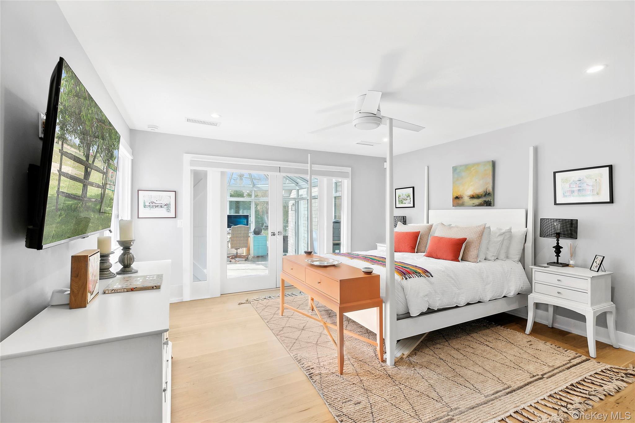 8 Shore Road Remsenburg, NY 11960 - Photo 13 of 21 a bedroom with a bed and large windows