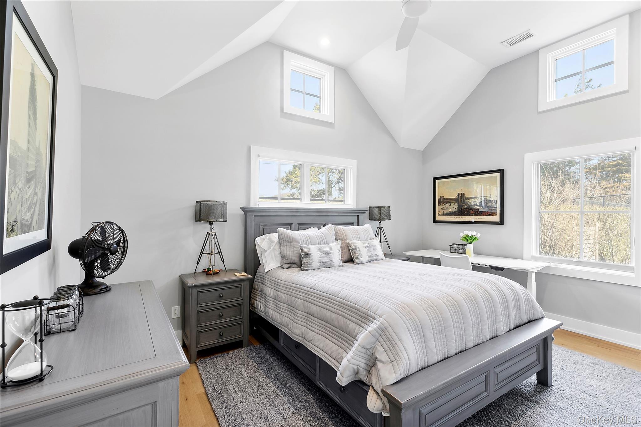 8 Shore Road Remsenburg, NY 11960 - Photo 15 of 21 a bedroom with a bed and wooden floor