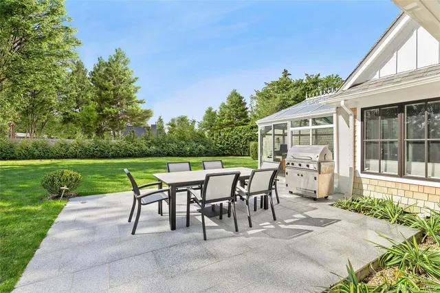 a patio with table and chairs