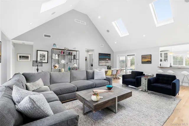 a living room with furniture fireplace and a window