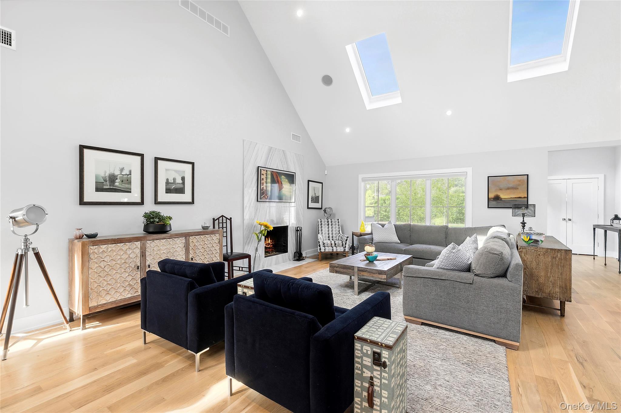 8 Shore Road Remsenburg, NY 11960 - Photo 6 of 21 a living room with furniture fireplace and a window