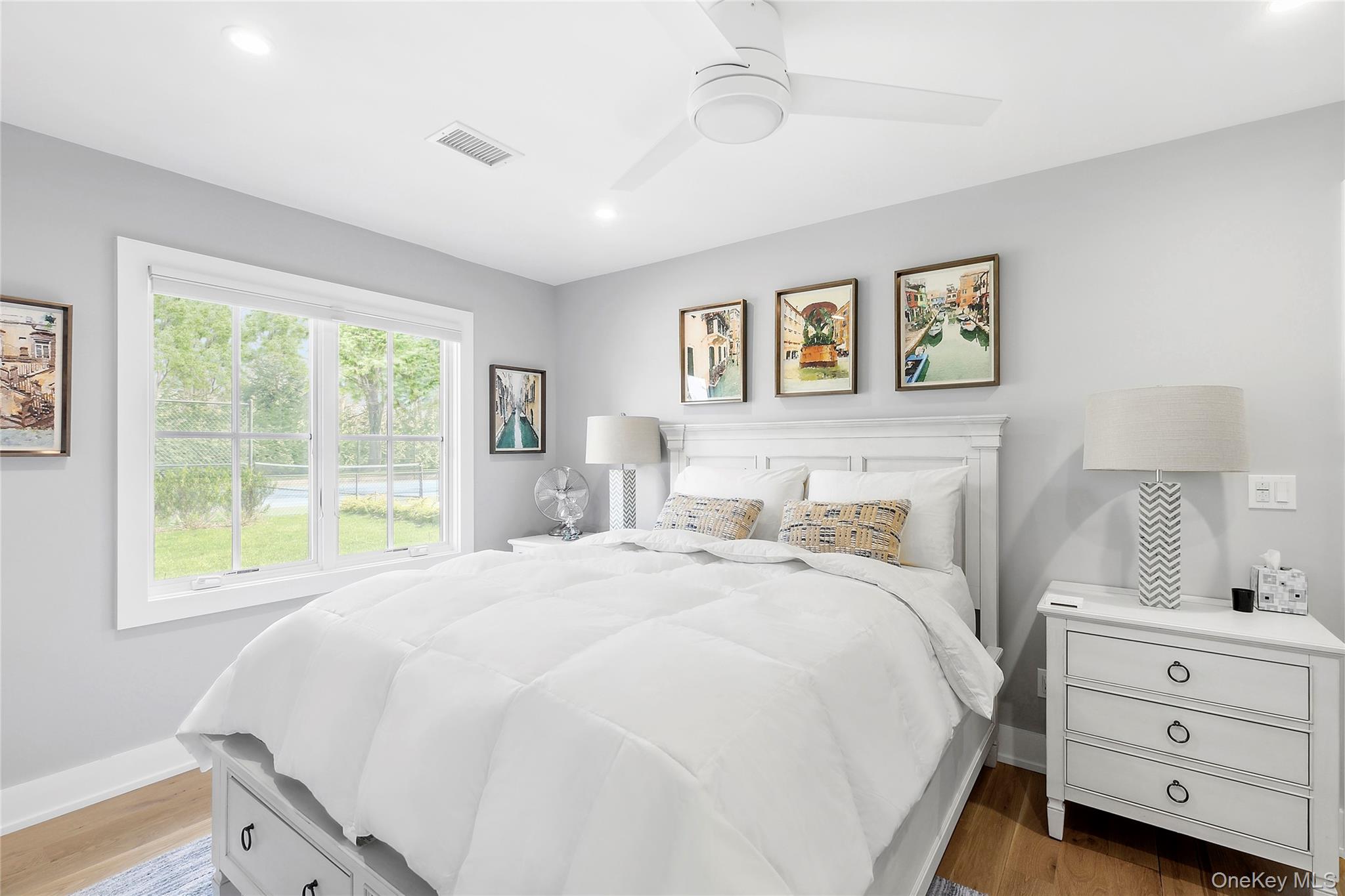 8 Shore Road Remsenburg, NY 11960 - Photo 9 of 21 a bedroom with a bed and a window