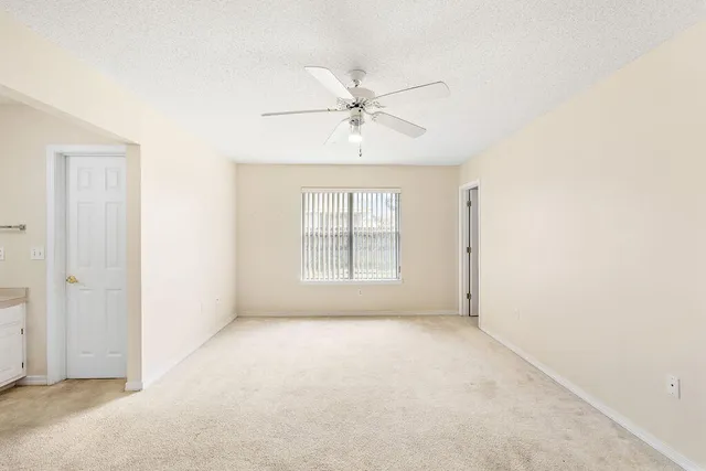 a bathroom with a sink toilet double vanity and shower