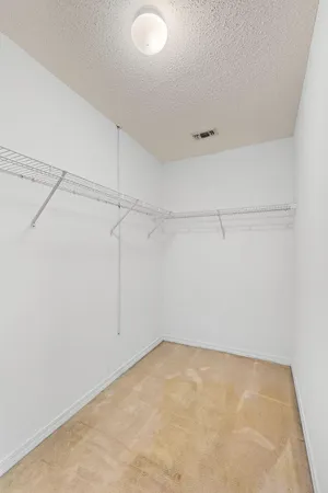 a view of a room with racks on the wall