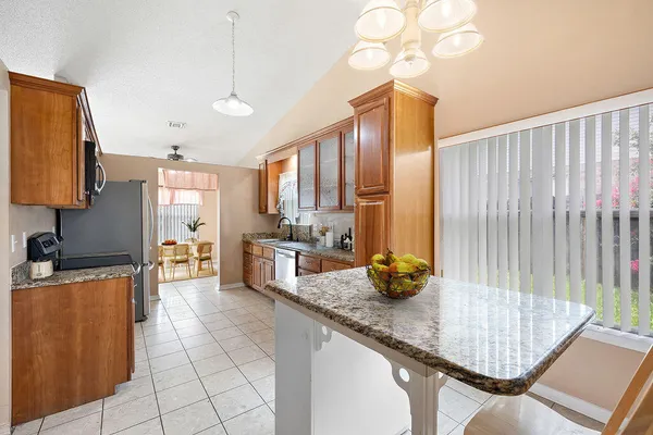a kitchen with counter space cabinets and appliances