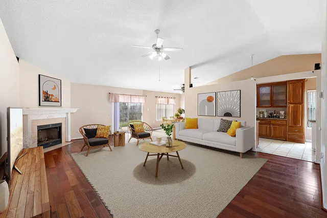 a view of an empty room with closet and a window