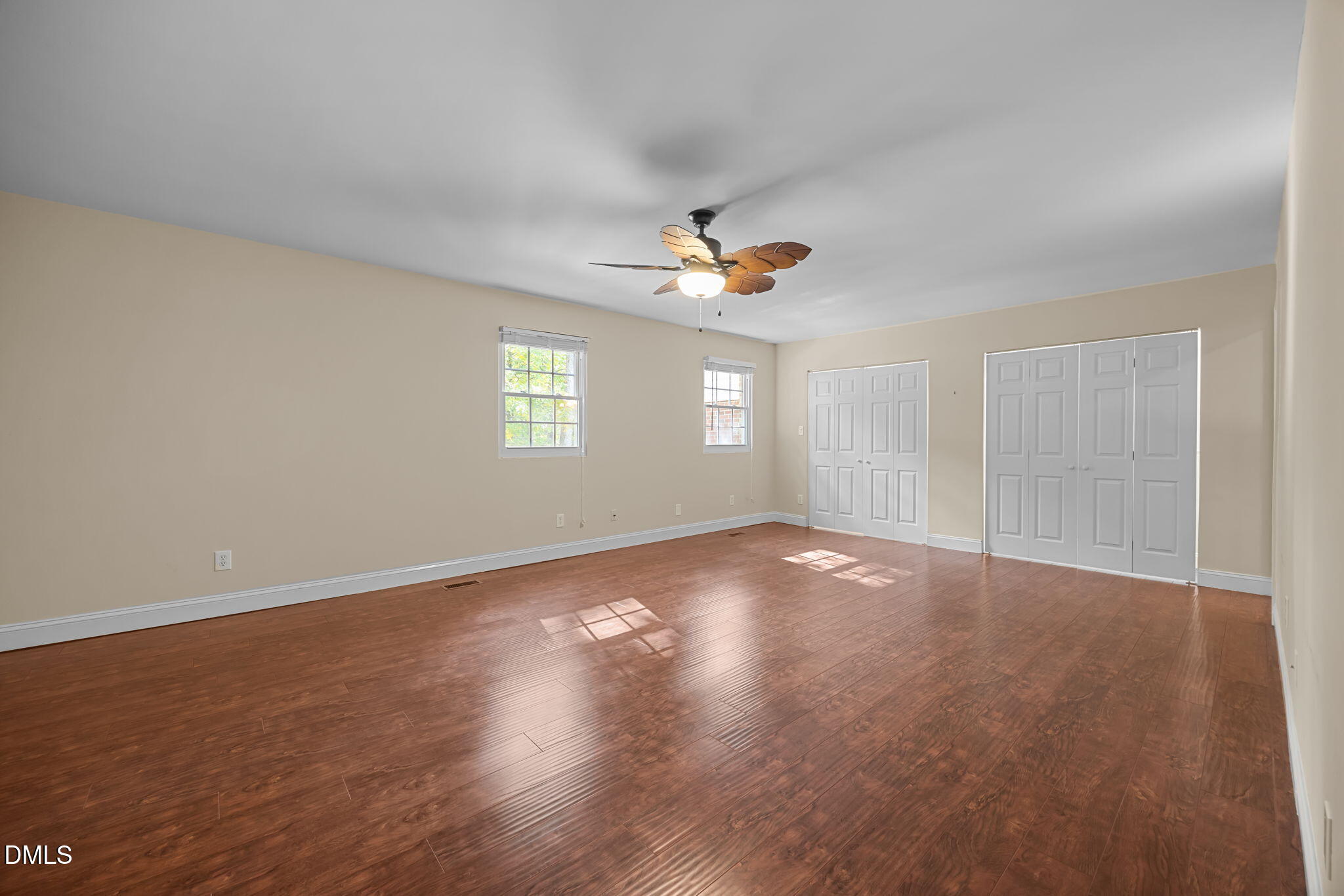 6423 New Market Way Raleigh, NC 27615 - Photo 11 of 33 wooden floor in an empty room with a window
