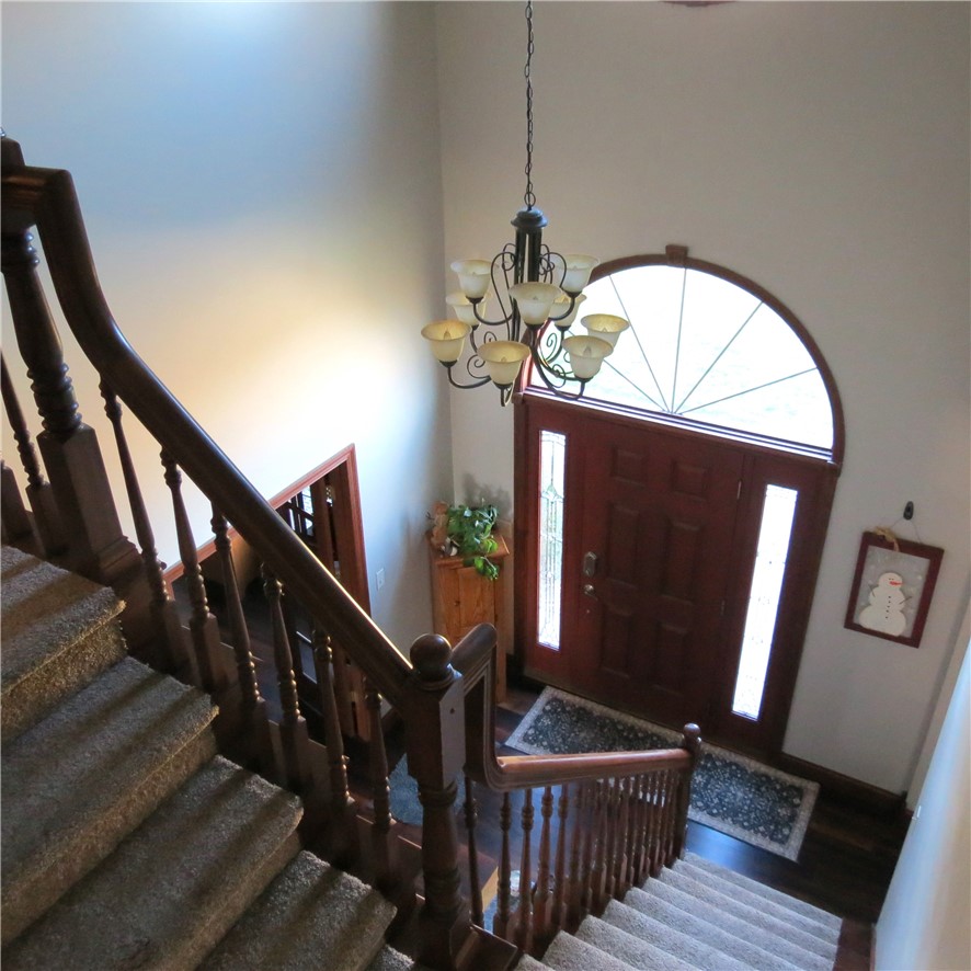 10160 Lochard Road Sidney, OH 45365 - Photo 5 of 41 An inviting entryway with a grand staircase and abundant natural light welcomes you home.