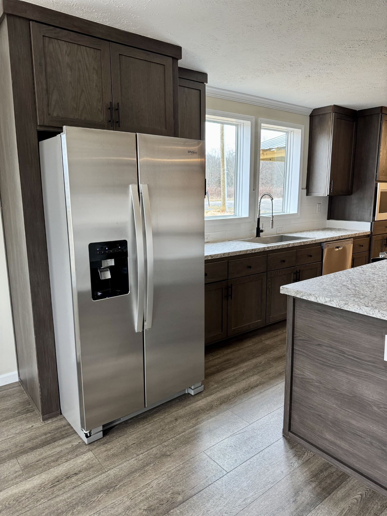 235 Ralph Spivey Lane Gainesboro, TN 38562 - Photo 17 of 39 a kitchen with granite countertop a refrigerator and a sink