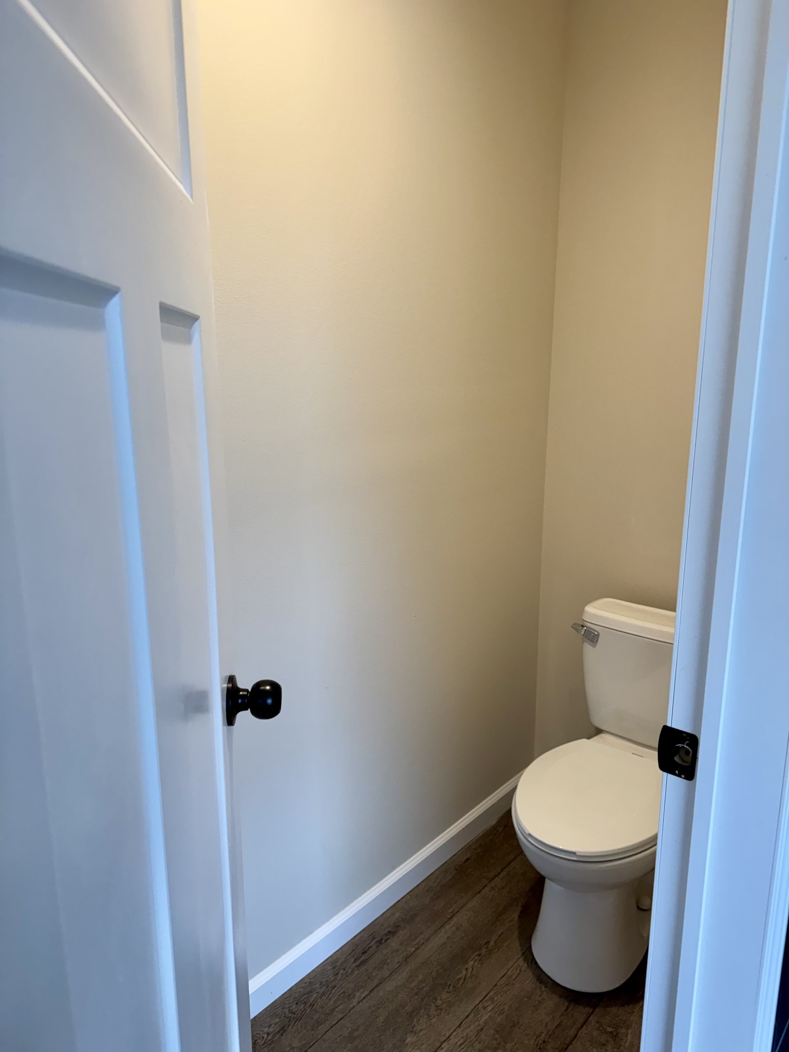 235 Ralph Spivey Lane Gainesboro, TN 38562 - Photo 32 of 39 a white toilet sitting next to a wooden cabinet