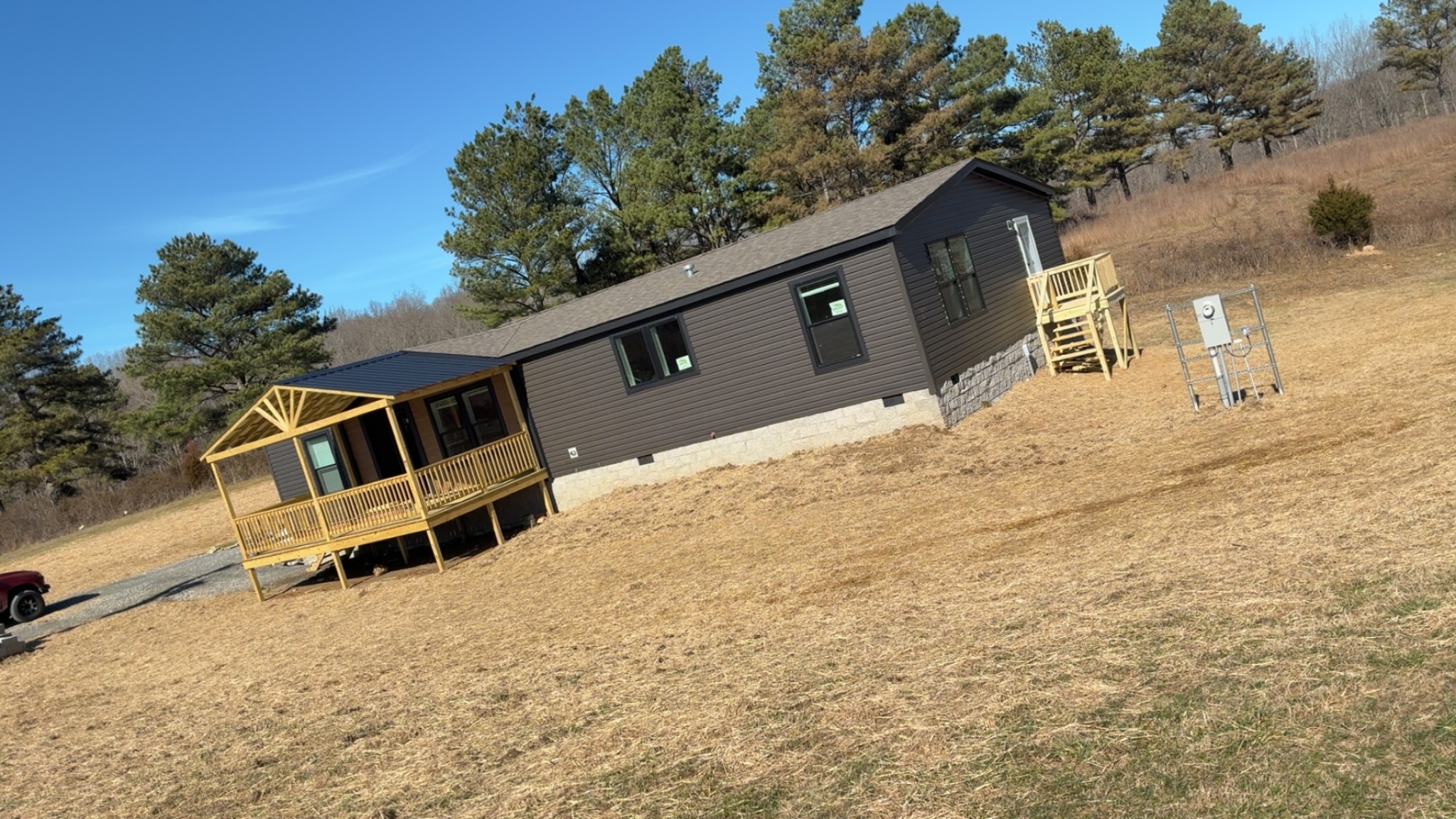 235 Ralph Spivey Lane Gainesboro, TN 38562 - Photo 5 of 39 a backyard of a house with wooden fence and trees
