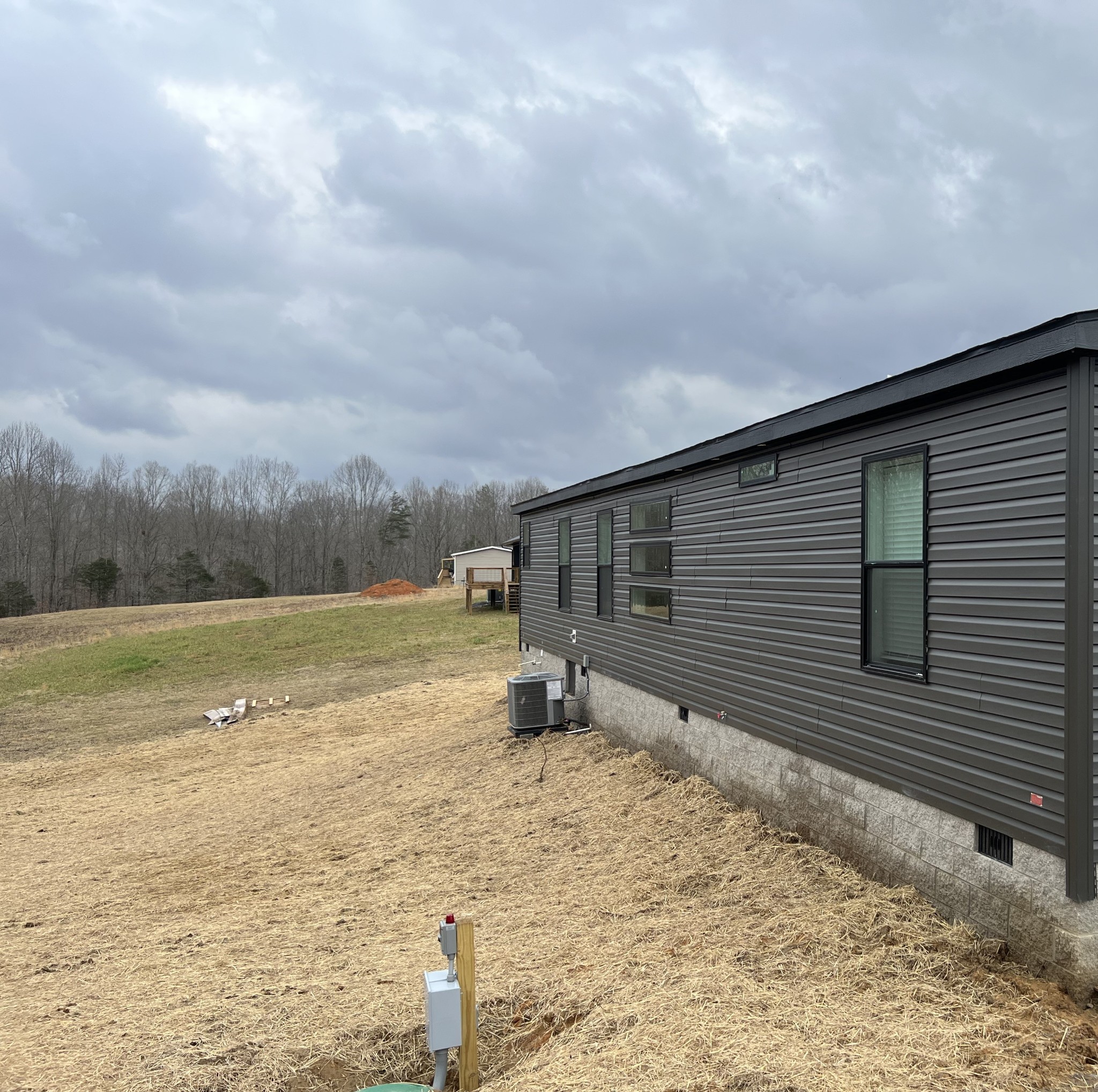 235 Ralph Spivey Lane Gainesboro, TN 38562 - Photo 9 of 39 a backyard of a house with lots of green space and wooden fence