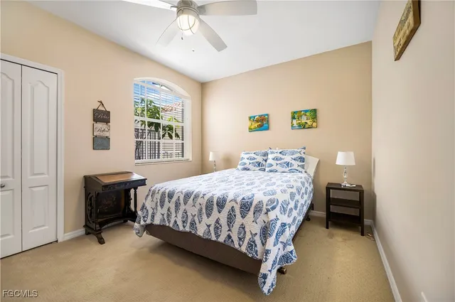 a bedroom with a bed and a table