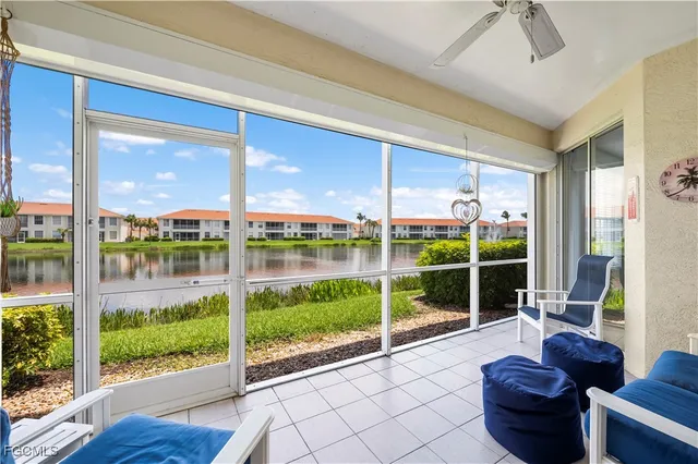 a view of a porch with furniture and garden