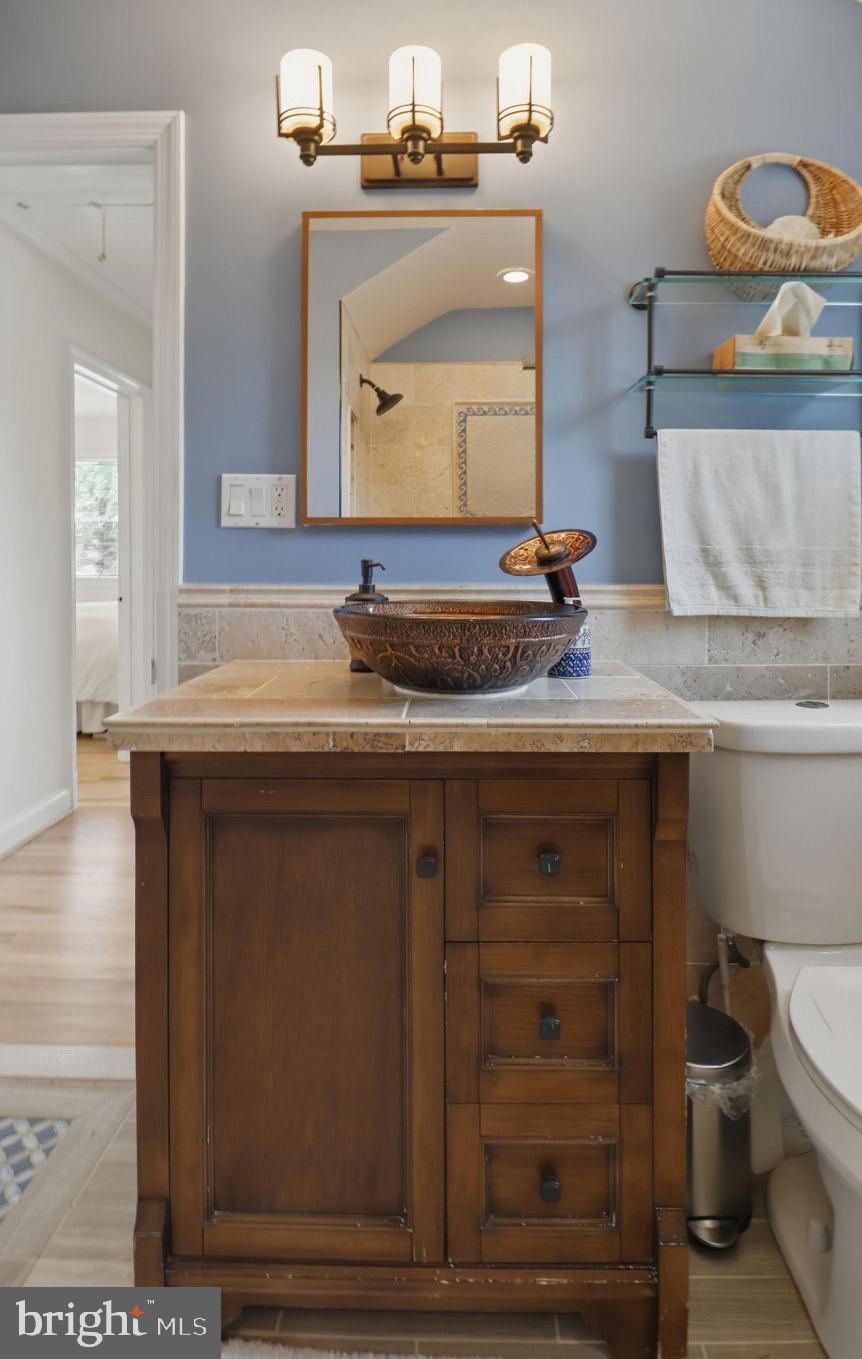 11708 Galt Avenue Silver Spring, MD 20902 - Photo 16 of 25 Charming bathroom with rustic elegance.