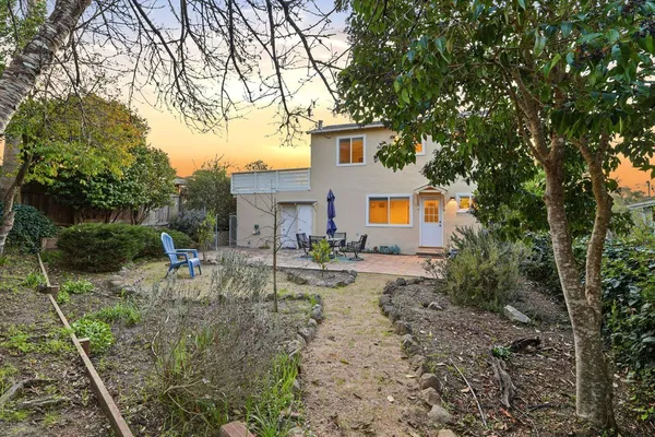 a sign board with yard in the back