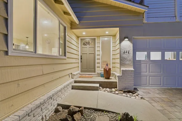 a swimming pool with outdoor seating and yard