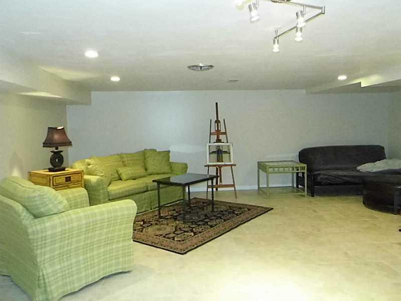 526 Sangree Road Pittsburgh, PA 15237 - Photo 21 of 25 Den/Family/Great Room. Lower level gameroom. This room was completely gutted, new drywall, new insulation, new lighting, and new ceramic tile flooring! There is a closet for storage that is plumbed for a bathroom.