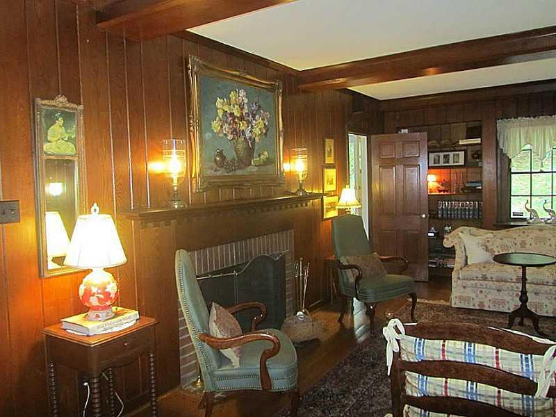 526 Sangree Road Pittsburgh, PA 15237 - Photo 7 of 25 Living Room. Log Burning Fireplace (not used by present owner), build-in bookcases on both walls, and door leading to a large front porch.