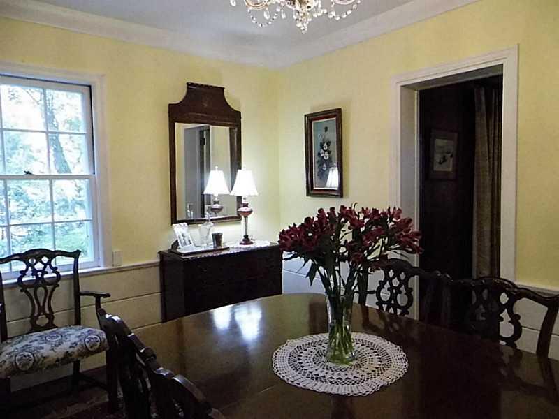 526 Sangree Road Pittsburgh, PA 15237 - Photo 8 of 25 Dining Room. Dining room with hardwood flooring, wainscoting, & crown moldings.