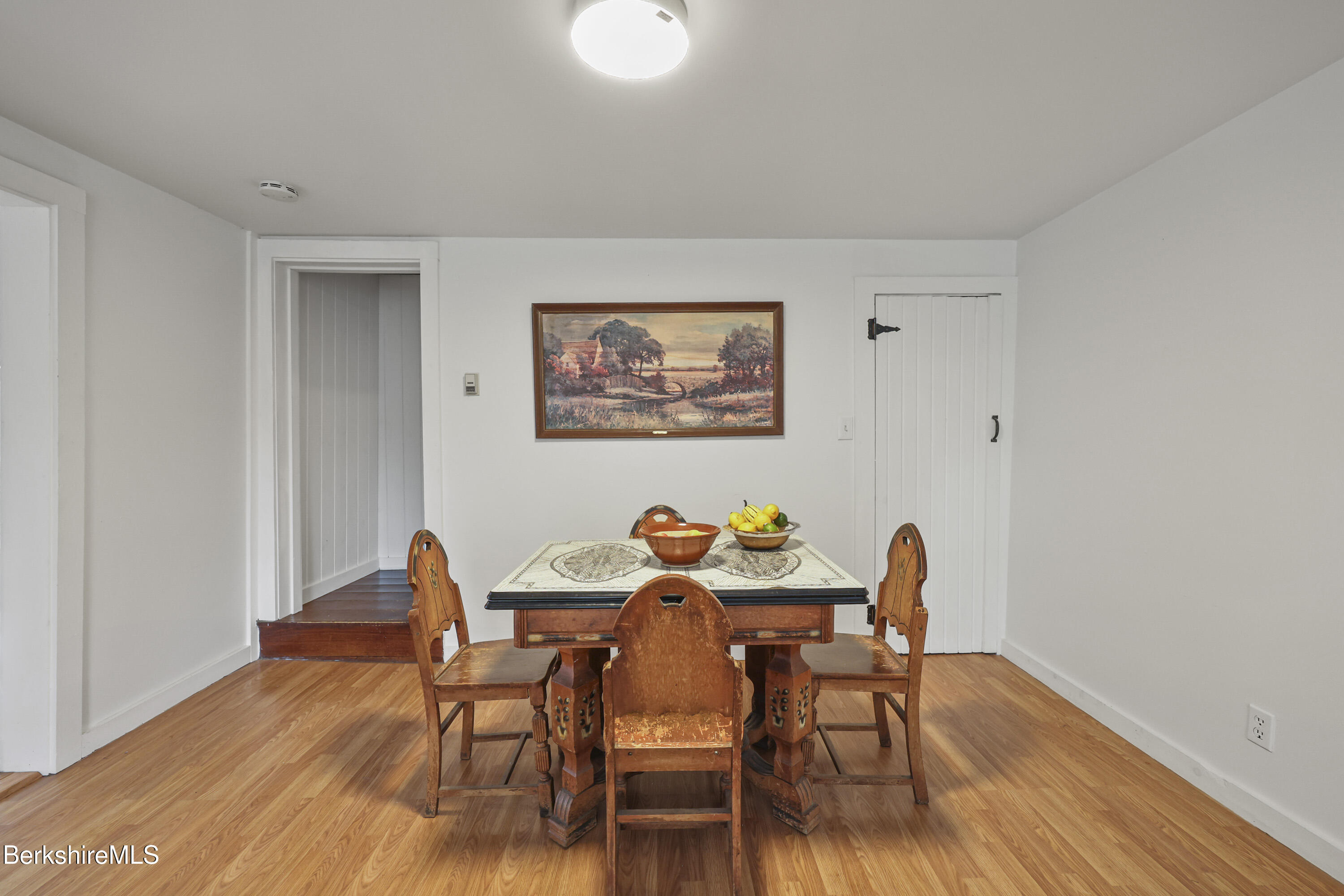 95 Water Farm Road Sheffield, MA 01257 - Photo 8 of 27 a view of a dining room with furniture and wooden floor