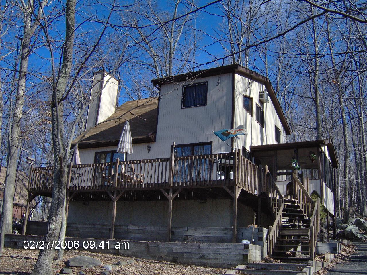 1243 Salsibury Road Bushkill, PA 18324 - Photo 1 of 8 a view of a house with wooden walls